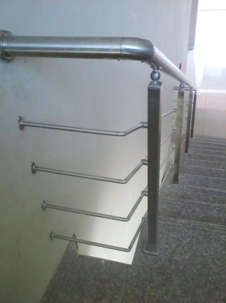 Stainless steel elbows at the 90-degree turn of the stainless steel staircase