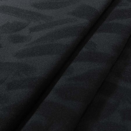 Tissu tricoté extensible à compression