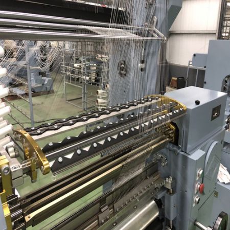 Narrow double needle bed warp knitting machine produce net bandage