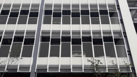 Expanded metal mesh facades introduce natural light from multiple angles.