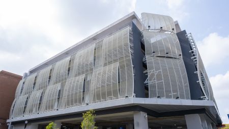 This mesh is manufactured using sophisticated bending and framing techniques to create a dynamic, wave-like facade that subtly moves with the wind. Strategically tilted, it reflects intense sunlight, lowering interior temperatures and promoting excellent air circulation.