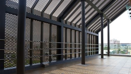 Expanded metal mesh facades introduce natural light from multiple angles.