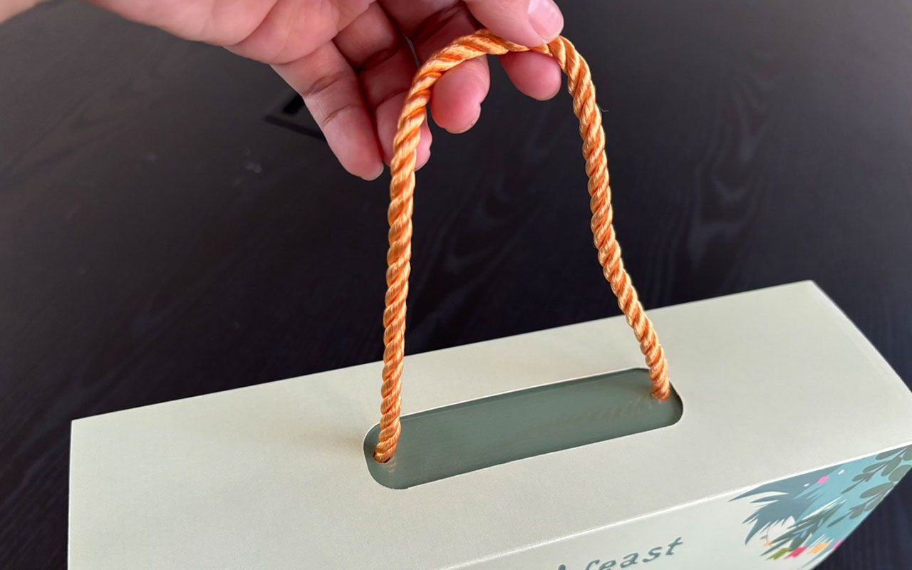 統合ハンドルデザインでパッケージ機能性を向上