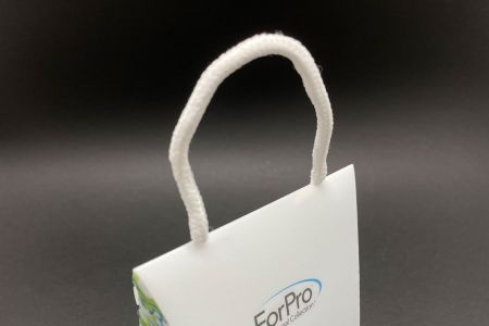 Caja de plástico PP para gorro de ducha - Asa de cuerda de algodón