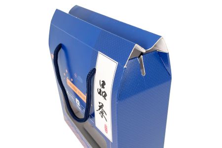 Imballaggio per tè in carta ondulata con scatola con manico