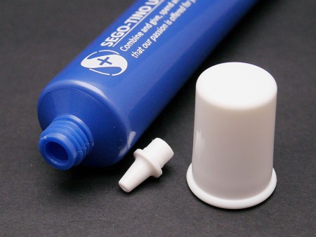 Personal care plastic soft tube with nozzle tip applicator.