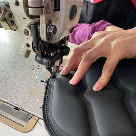 To craft a durable body protector vest, skillfully sew binding along the edges