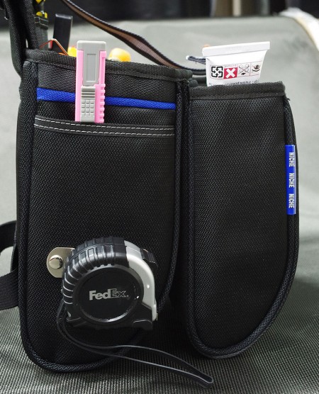 Measuring tape clip and side pocket