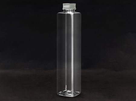 Butelki PET 38mm 1032ml Grube sześcianowe (66-1004) - Butelka PET o pojemności 1032 ml w kształcie grubej kostki do pakowania chłodzonych napojów z certyfikatami FSSC, HACCP, ISO22000, IMS, BV