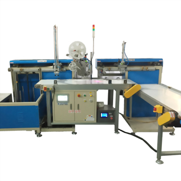 Automatic Labeling Machine with Barcode Reader - A large, blue-gray industrial automation machine, featuring a central control unit, blue panels on both sides, a conveyor belt, and a label roll, set against a clean white background.