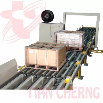 Wood Box Strapping Machine - Front view of the TC-885 automatic wood box strapping machine, highlighting its integrated conveyor and robust strapping head.