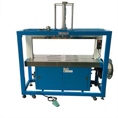 Pressure Strapping Machine - Front view of the Tian Cherng Automatic Pressure Strapping Machine, designed for securing bulky bags and loose products.